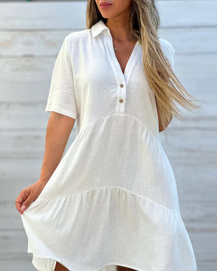 Einfarbiges, legs kleid mit revers und knöpfen